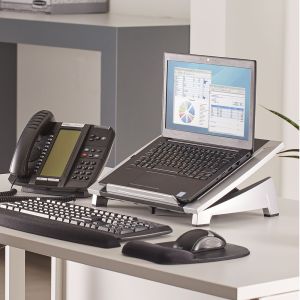 Office Suites™ Laptop Riser - lifestyle shot, shown with a laptop, separate keyboard and mouse, in an office environment