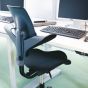 HÅG Capisco Puls 8020 Ergonomic Office Chair - lifestyle shot, showing the black chair in an office environment