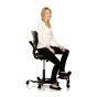 HÅG Capisco Puls 8020 Ergonomic Office Chair - lifestyle shot, showing the black chair with a HÅG Step-Up (in black)