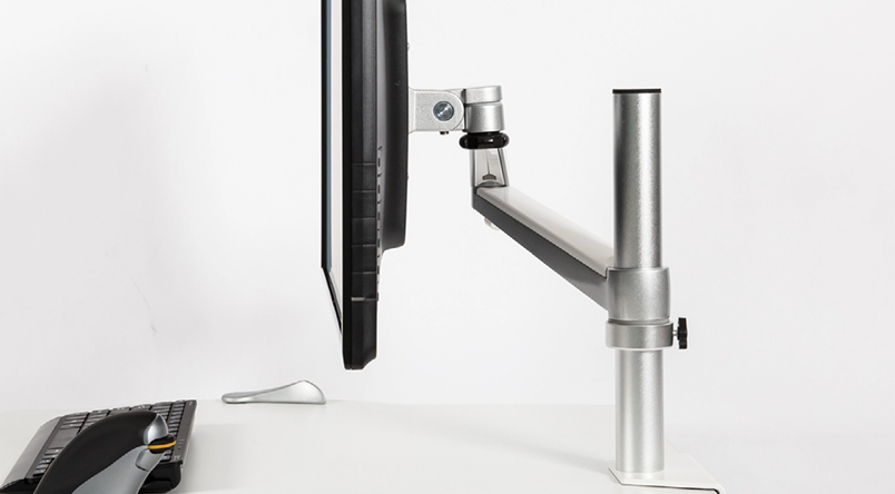 Side shot of the Oploft Monitor Arm connected to monitor and Oploft Sit-Stand Platform